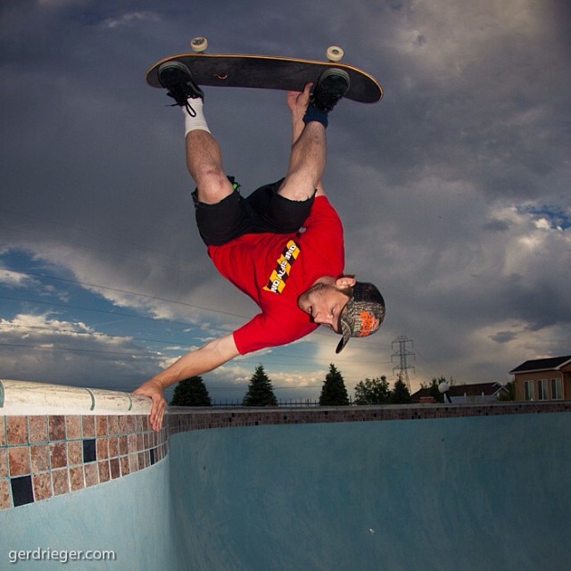 In between rain showers and thunderstorms Zach Cusano plants an Andrecht on the hip at Lindsey's pool.